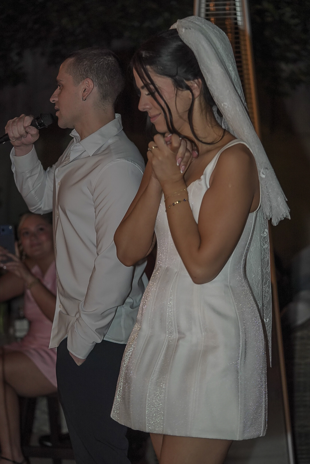 Couple embracing during an outdoor ceremony for a storytelling session.