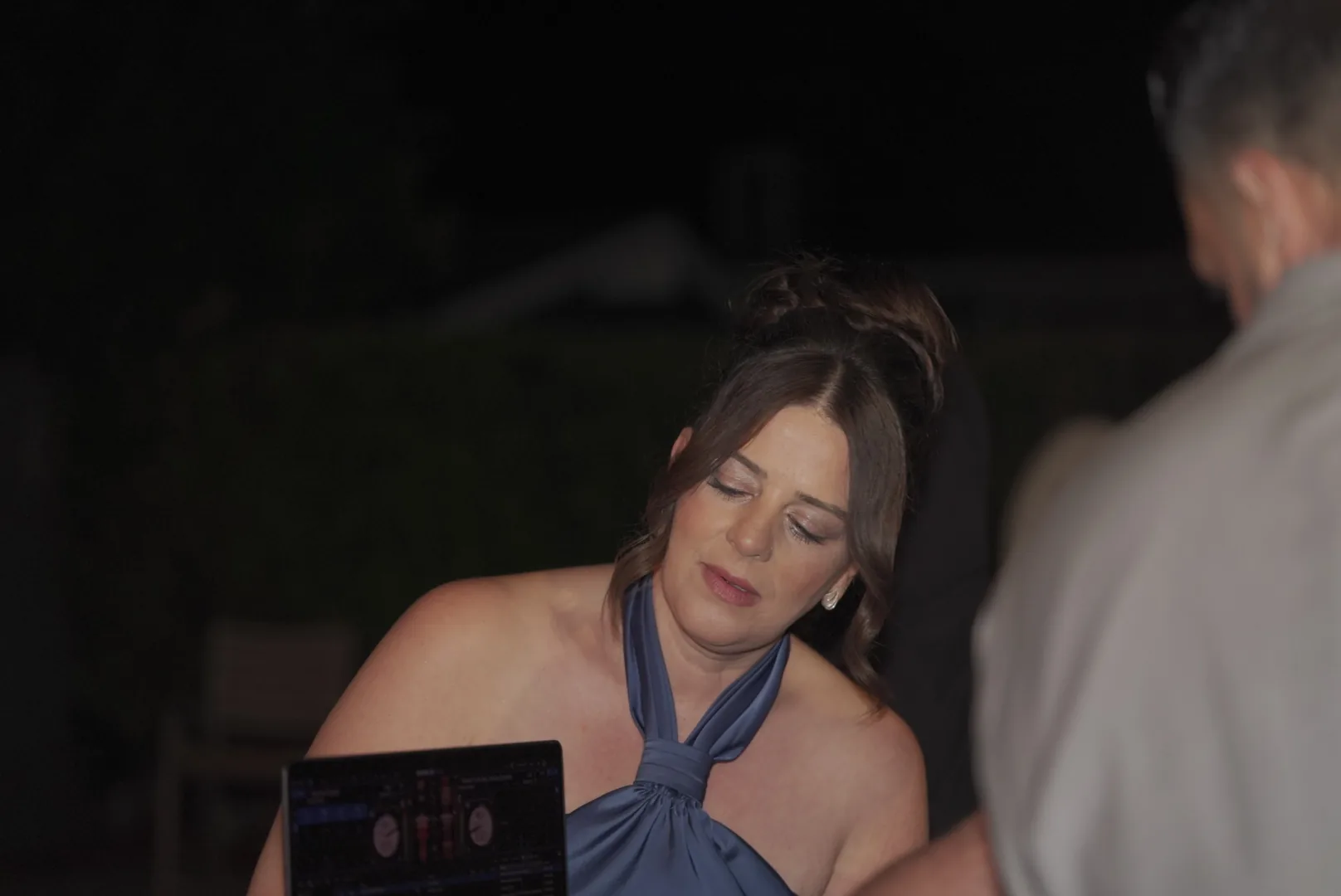 Wedding guest opening a gift during the reception
