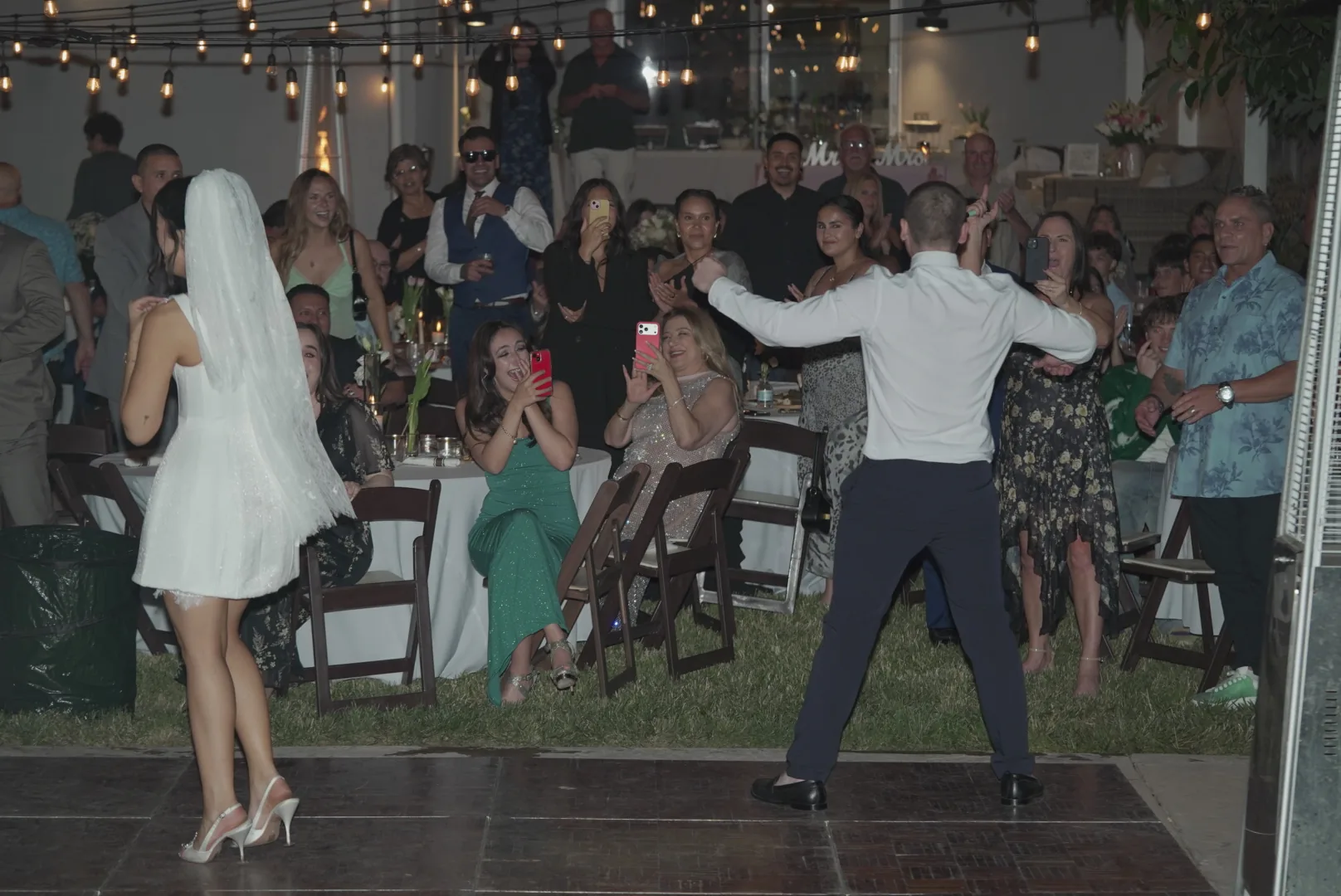 Guests celebrating during an outdoor wedding reception