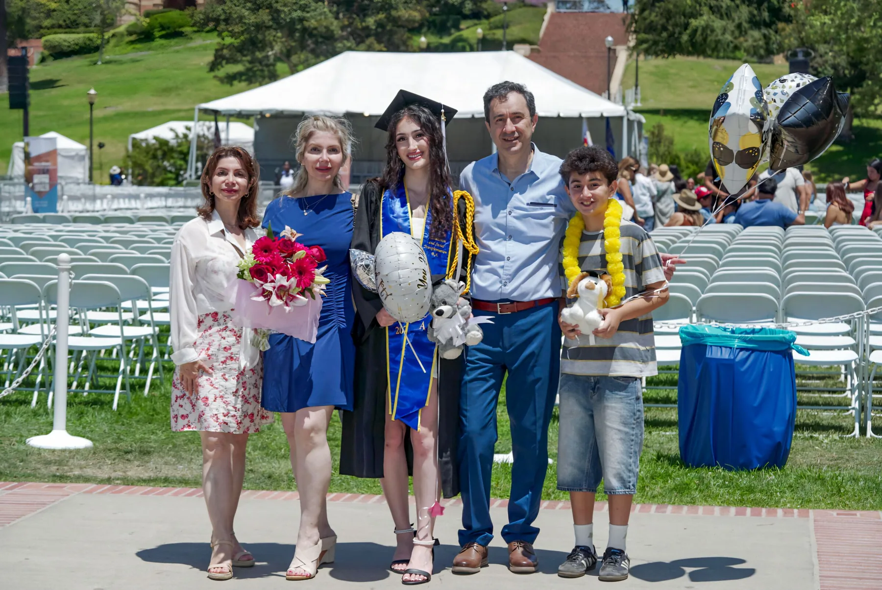Graduate celebrating with family after commencement